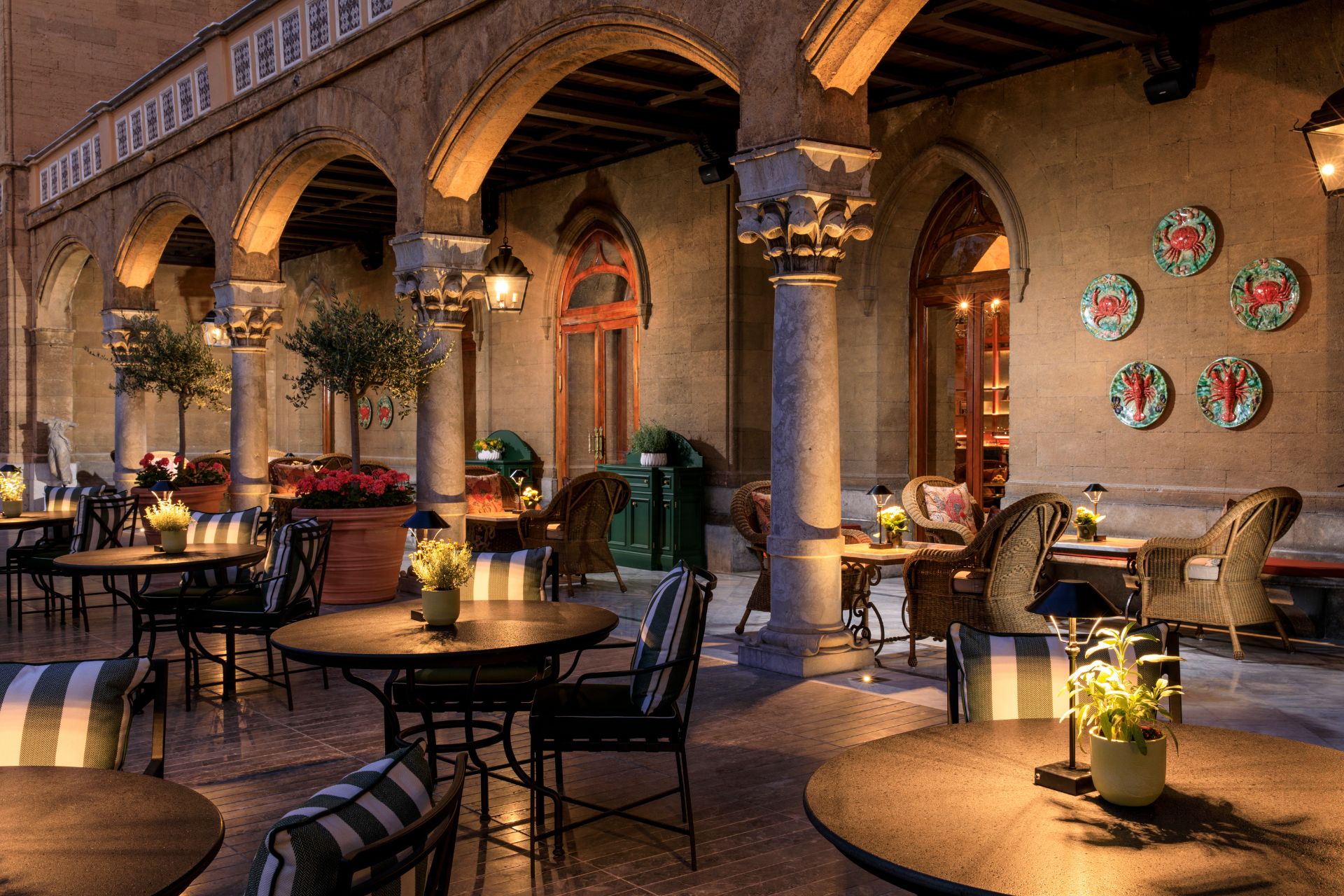 Restaurant with stone arches and dark wooden furniture