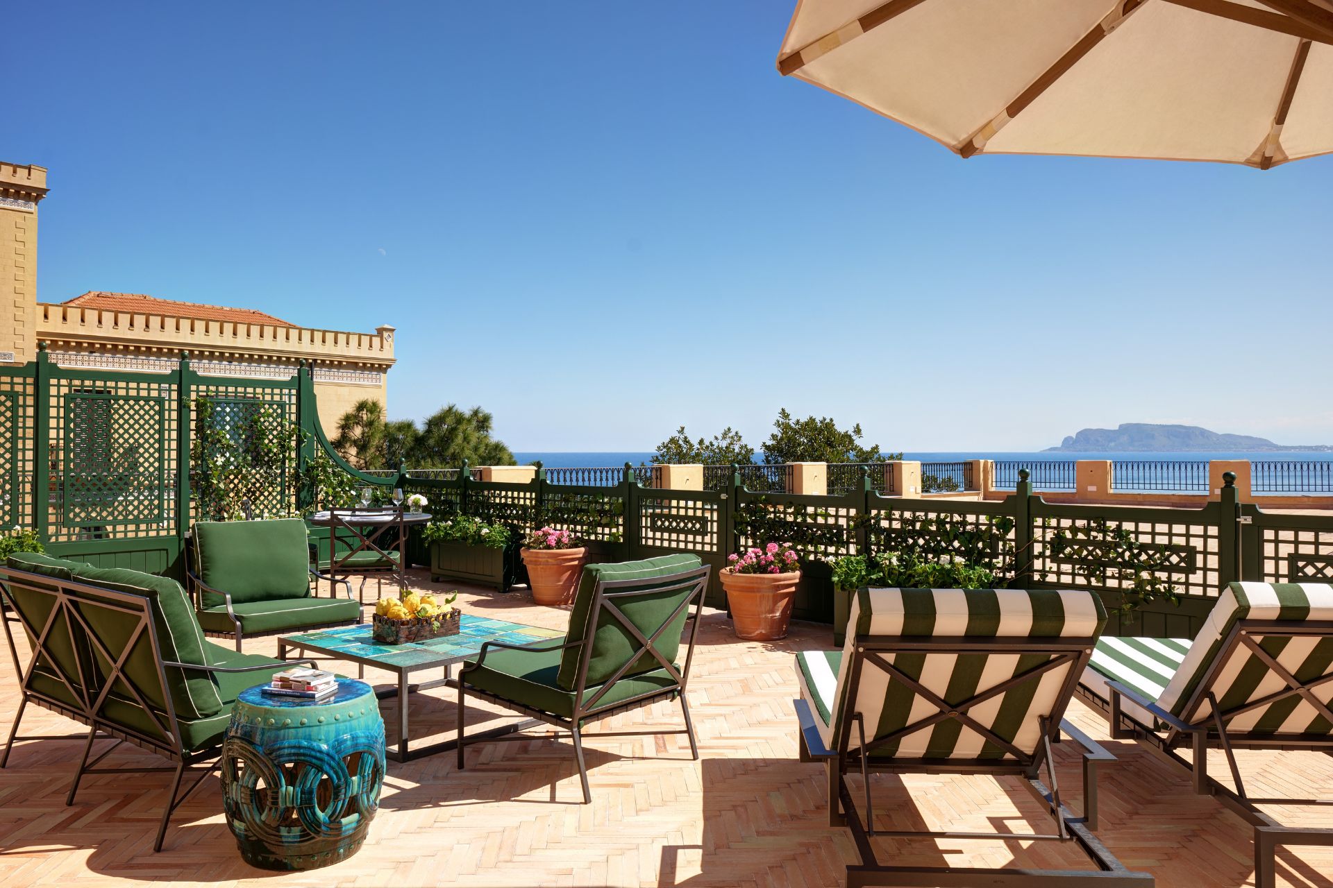 Rooftop pool with potted plants and views of Palermo