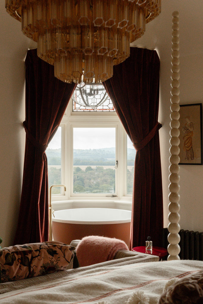 Rolltop bath beside a window