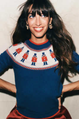 Woman wearing blue Christmas jumper | history