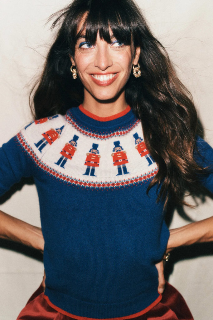 Woman wearing blue Christmas jumper | history
