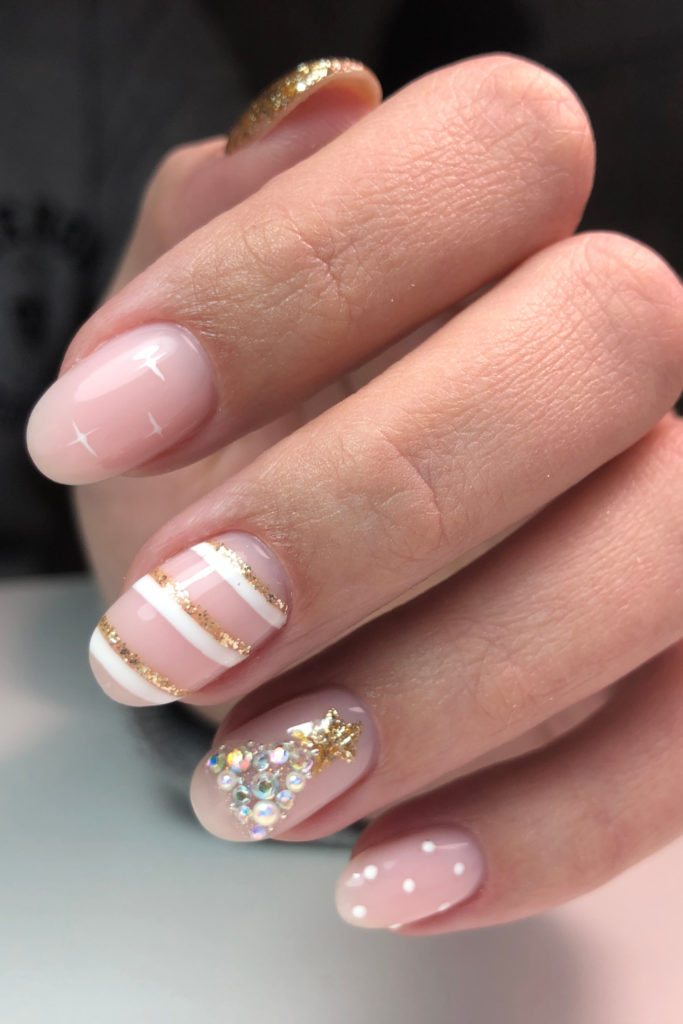 Hand with Christmas tree nails