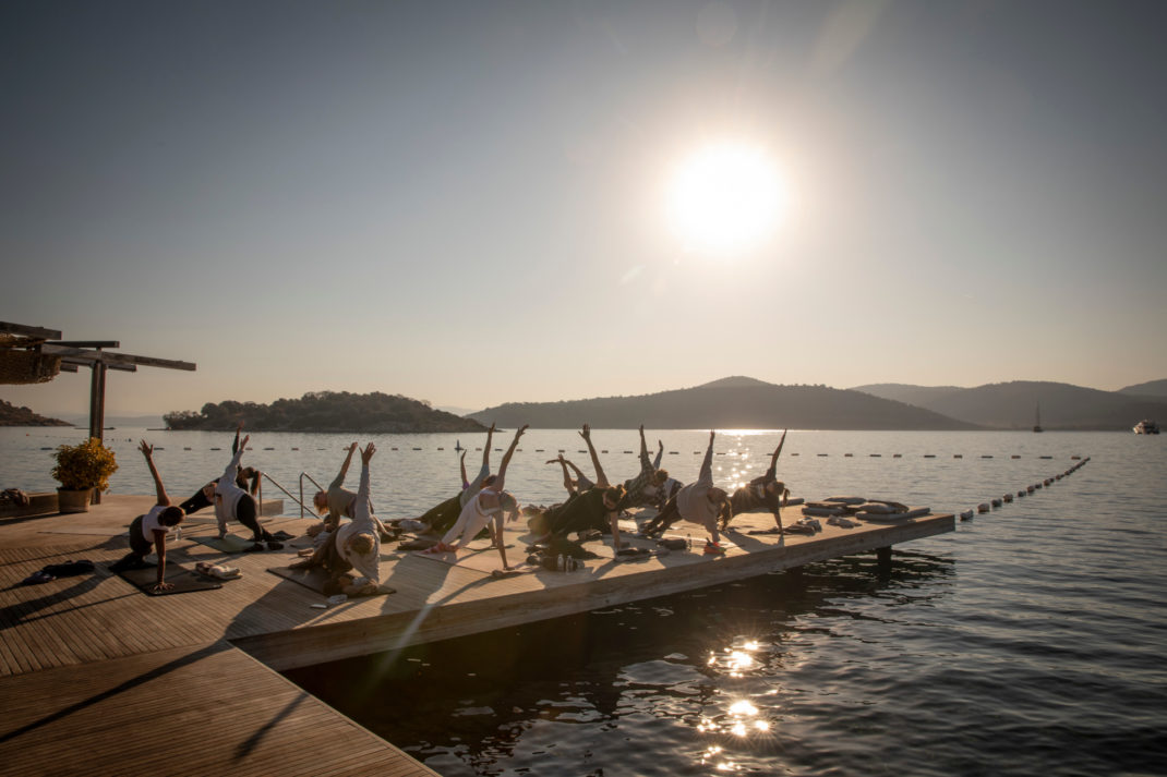 People doing yoga at sunrise at Maçakızı Reconnects