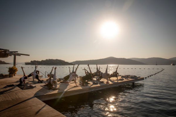 People doing yoga at sunrise at Maçakızı Reconnects