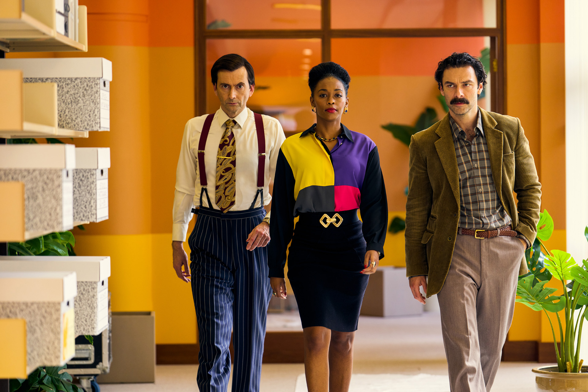 David Tennant as Lord Tony Baddingham, Nafessa Williams as Cameron Cook &Aidan Turner as Declan O’Hara in Rivals