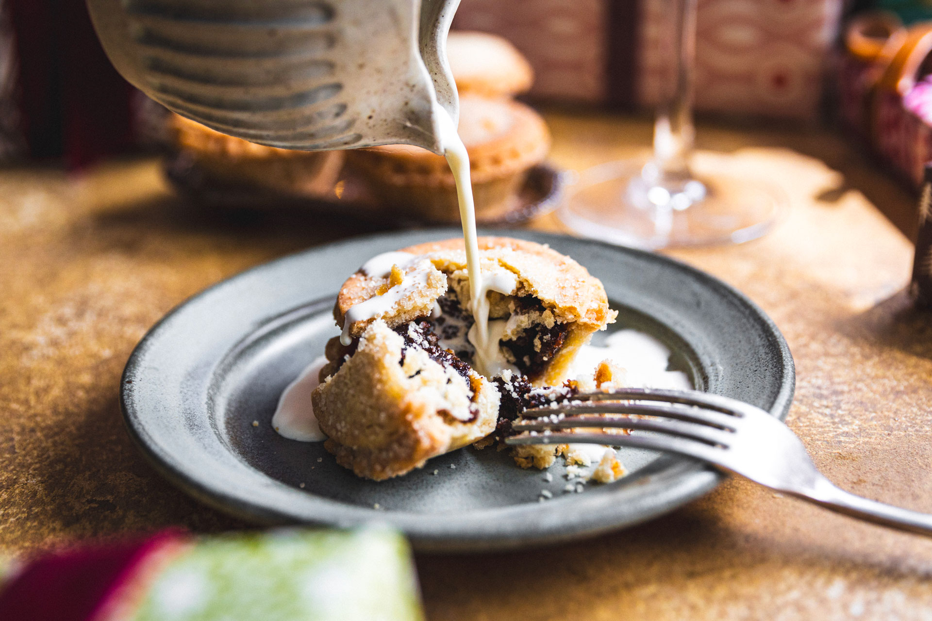 Riverford Organic's mince pie, cream being poured onto it