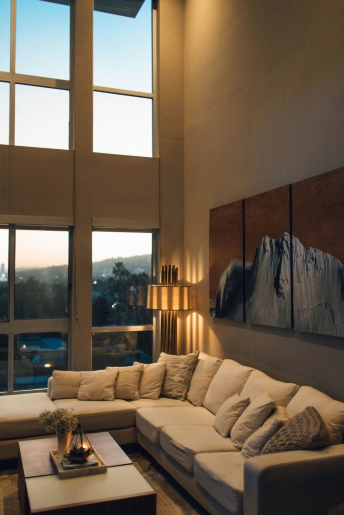 Apartment with tall windows and a cream sofa