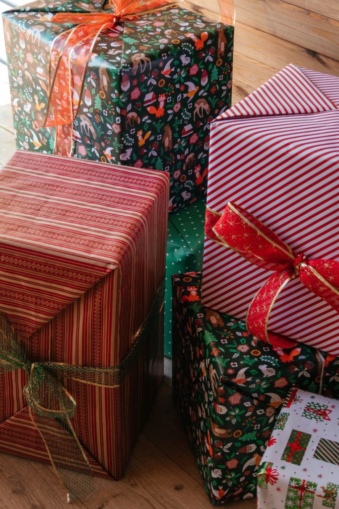 Boxes wrapped in red and green paper with red ribbons