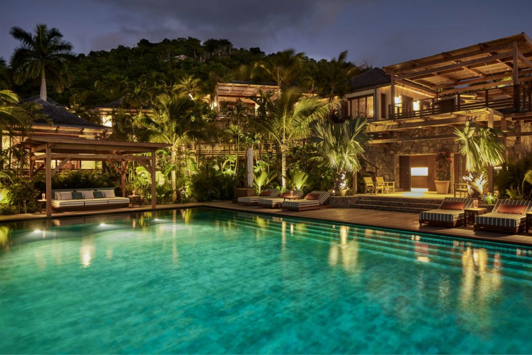 Caribbean compound with pool at night