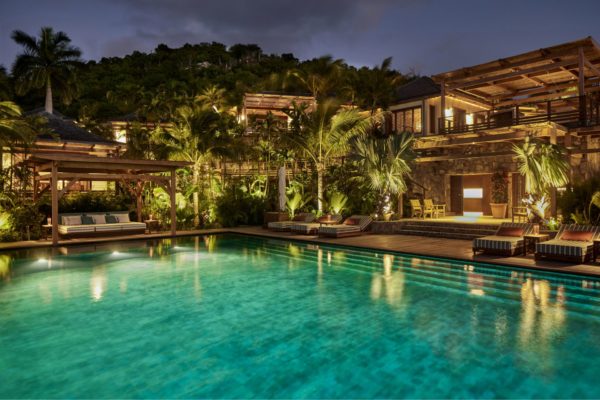 Caribbean compound with pool at night