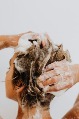 Blonde woman washing her hair