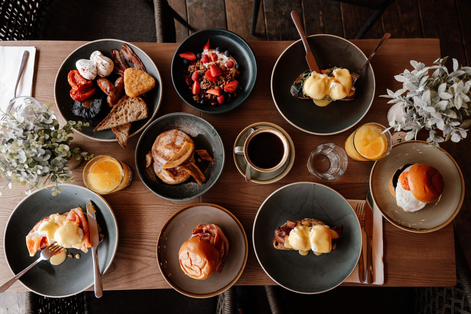 Aerial view of wooden table with brunch dishes
