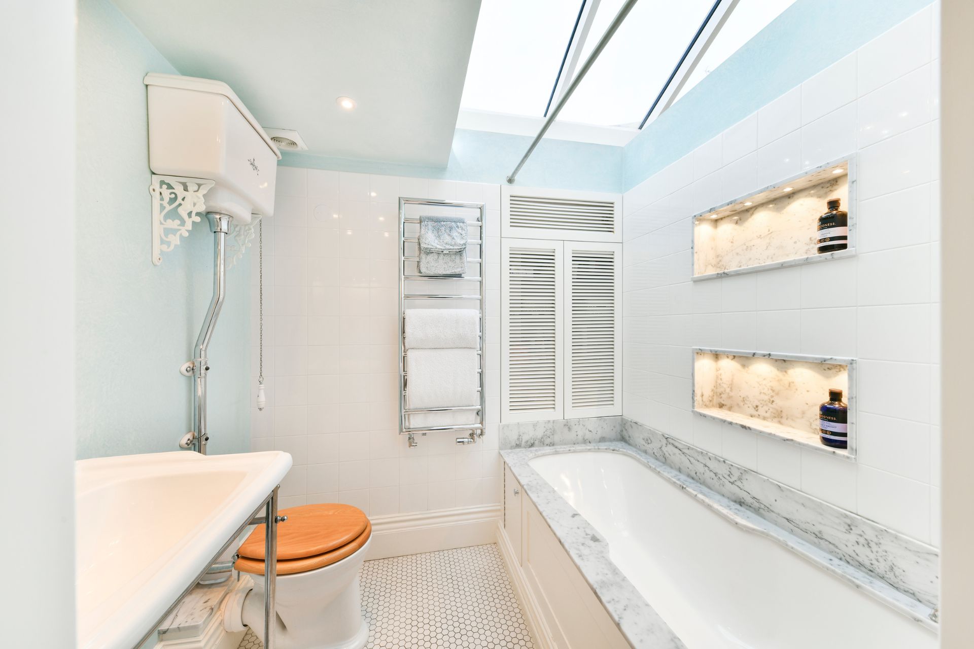 Bathroom with white marble built--in bath