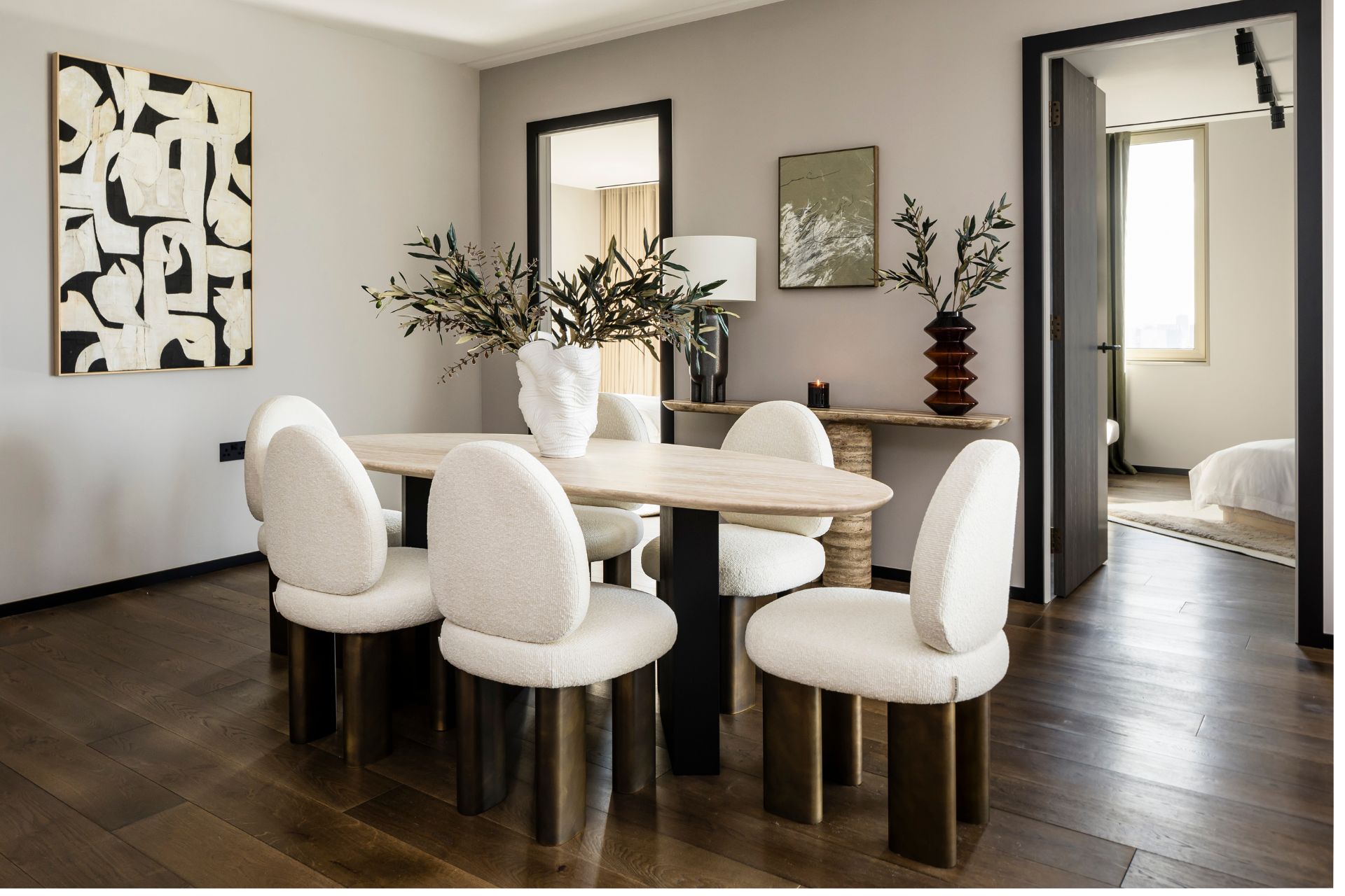 Modern dining table with cream boucle chairs