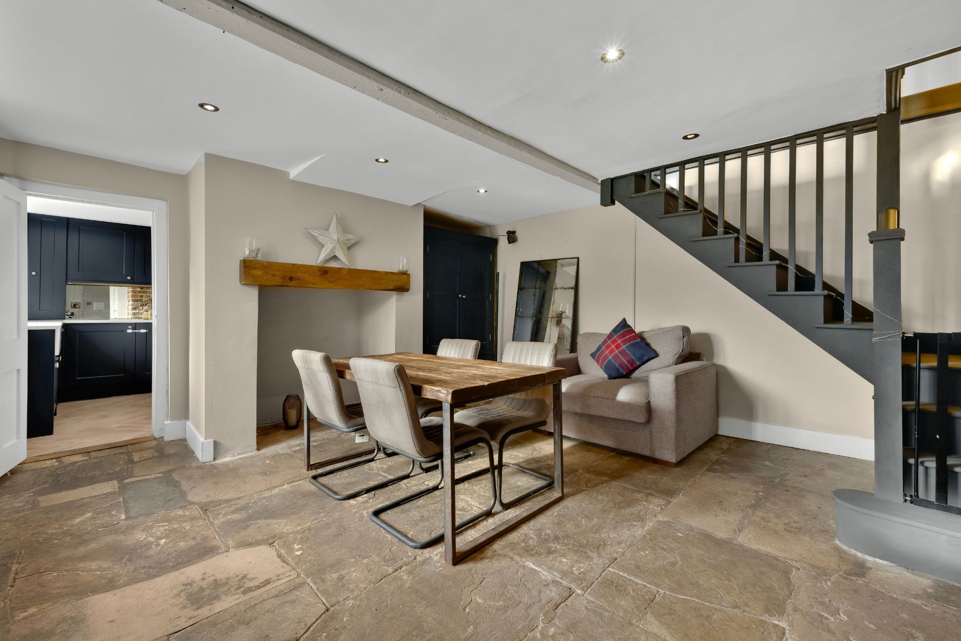 Dining room with stone floors and a feature fireplace