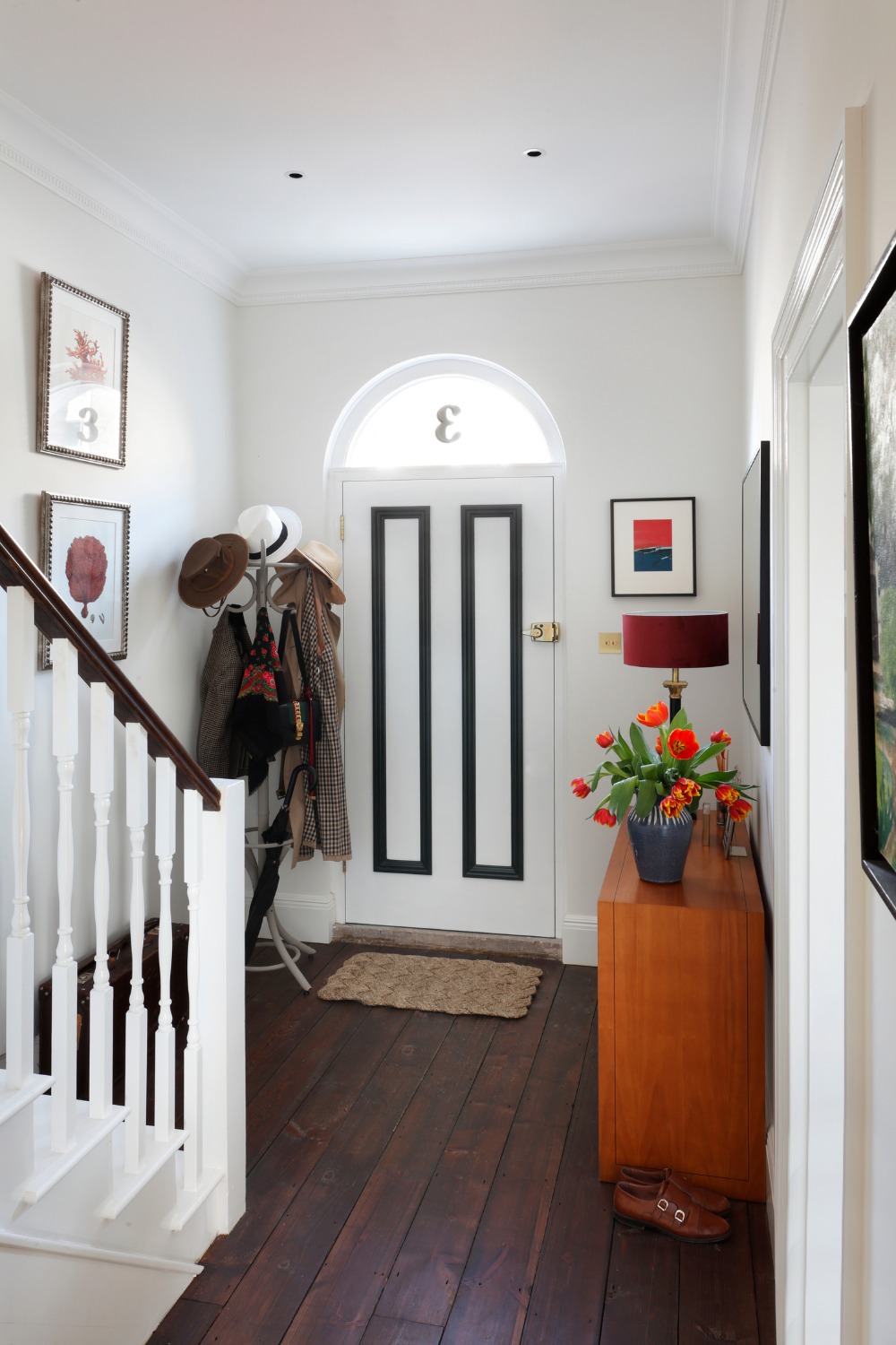 Hallway and entryway with wall gallery