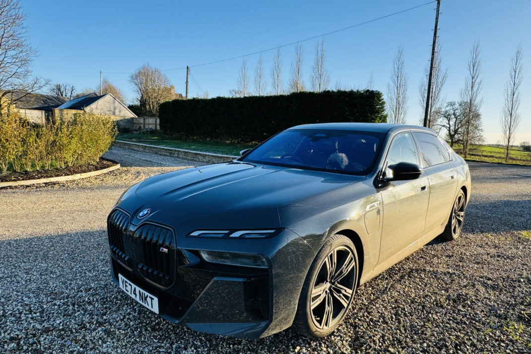 The BMW on a gravel driveway