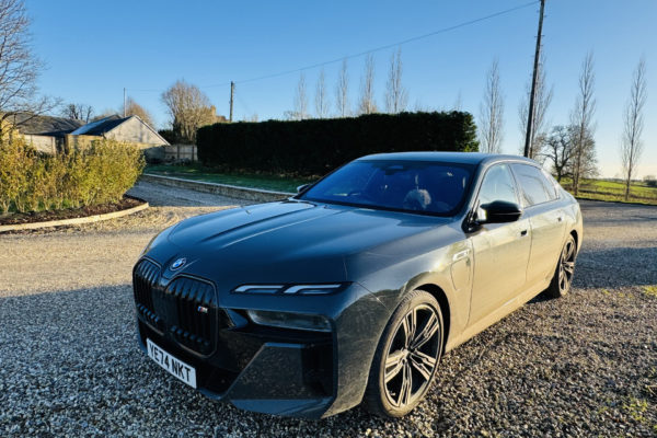 The BMW on a gravel driveway
