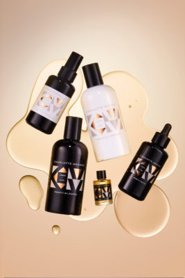 Bottles in serum on bronze background | independent british beauty brands
