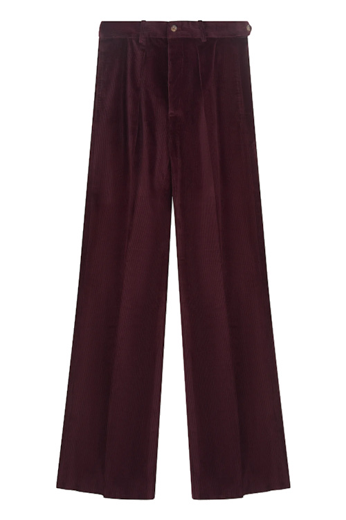 Burgundy trousers | claudia winkleman traitors outfit