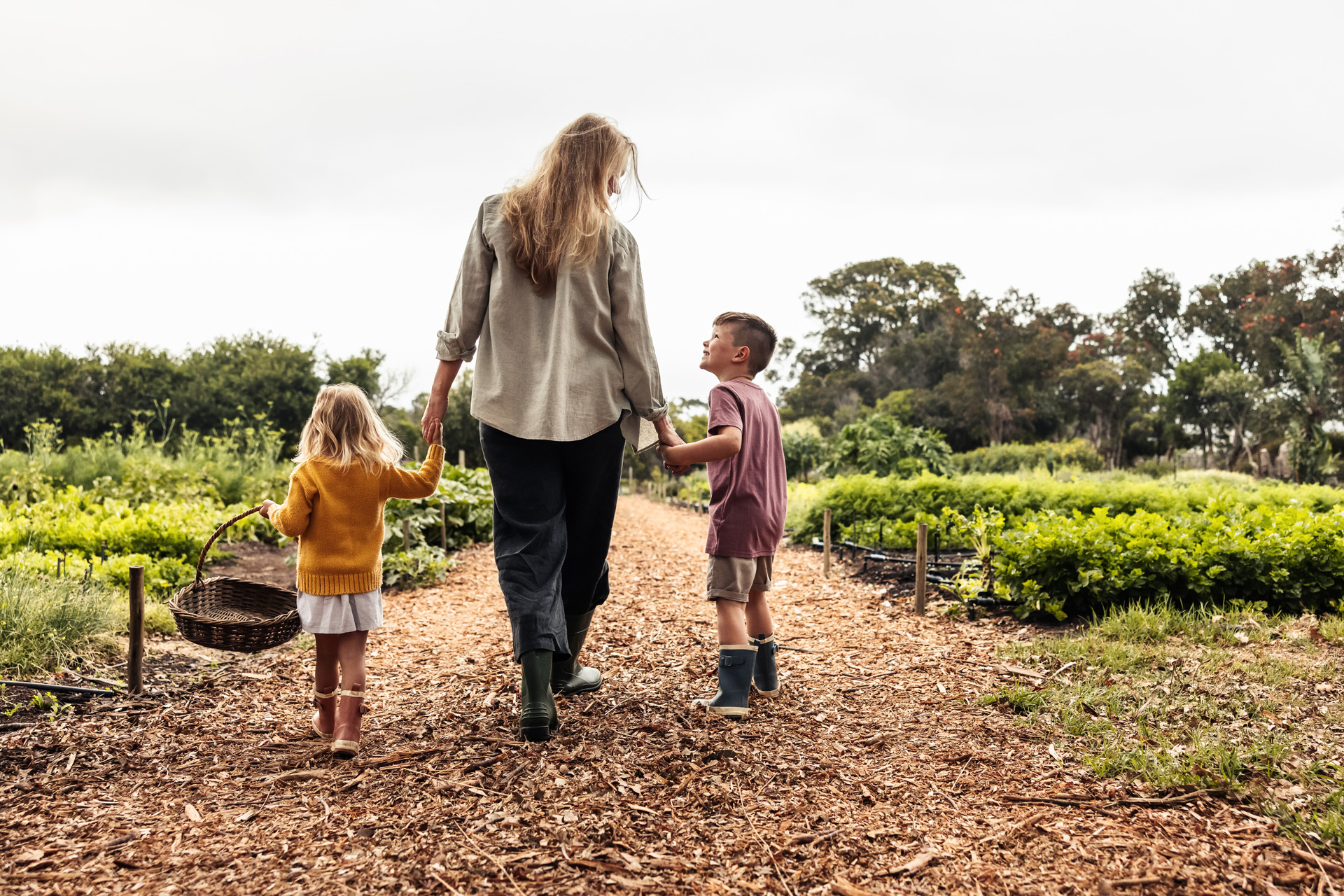 Mother and two children visiting a farm
