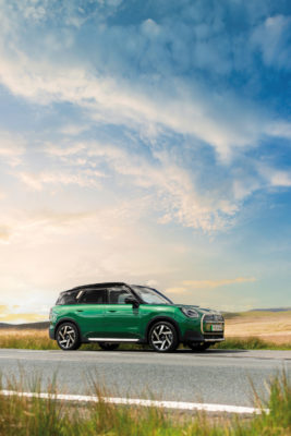 Green mini on road