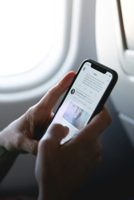 Hands scrolling phone | how to reduce screentime