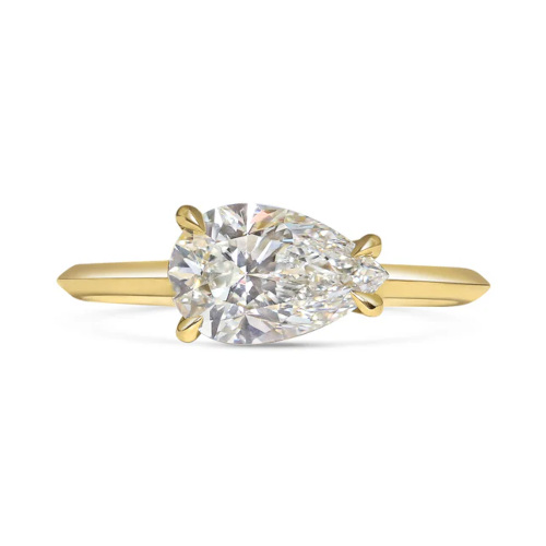 Gold east-west engagement ring