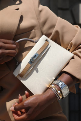 Arms holding vintage designer bags | London vintage shops