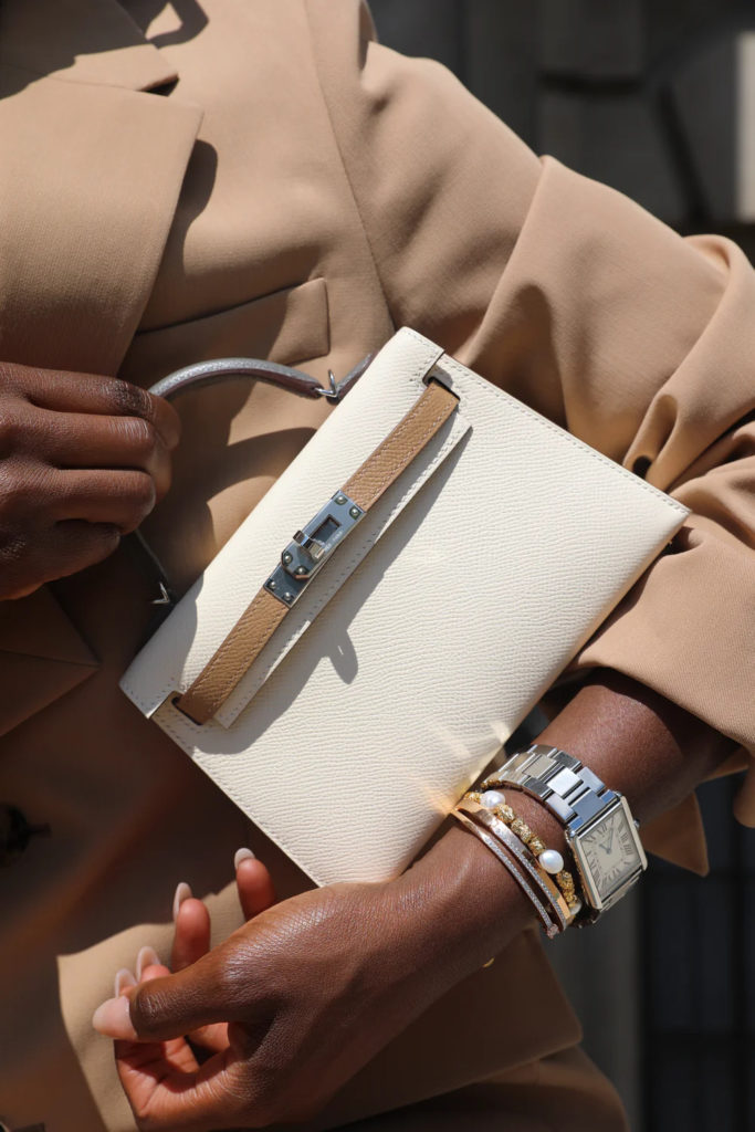 Arms holding vintage designer bags | London vintage shops