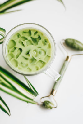 Iced matcha with skincare tool