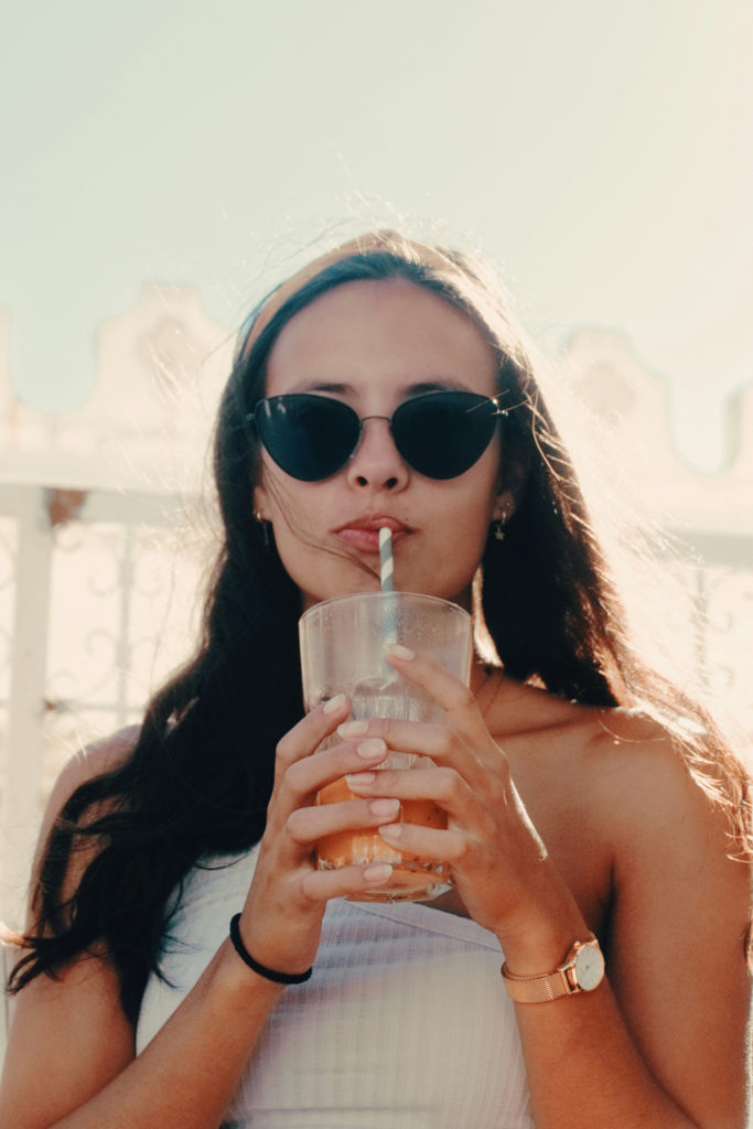 Woman drinking from straw | anti-wrinkle straw debate