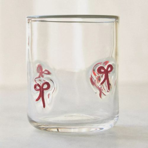 Glass with red bow motif