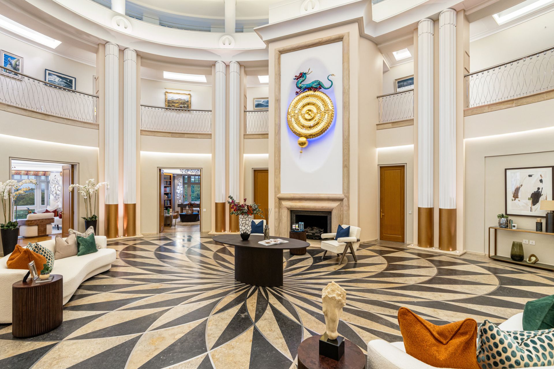 Elliptical entrance hall with stone floors and high ceilings