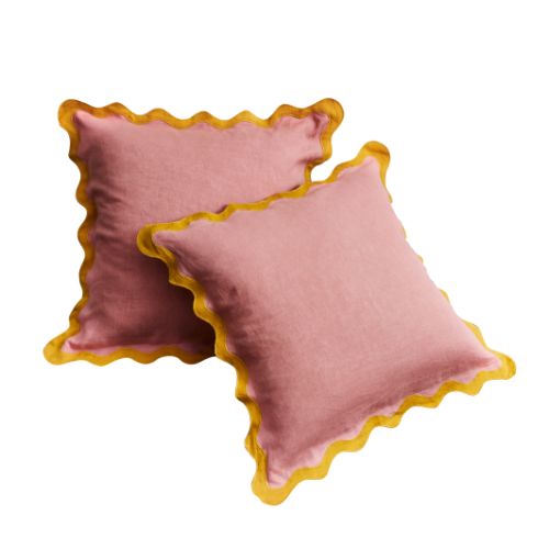 Pale pink scalloped pillowcases with mustard yellow trim