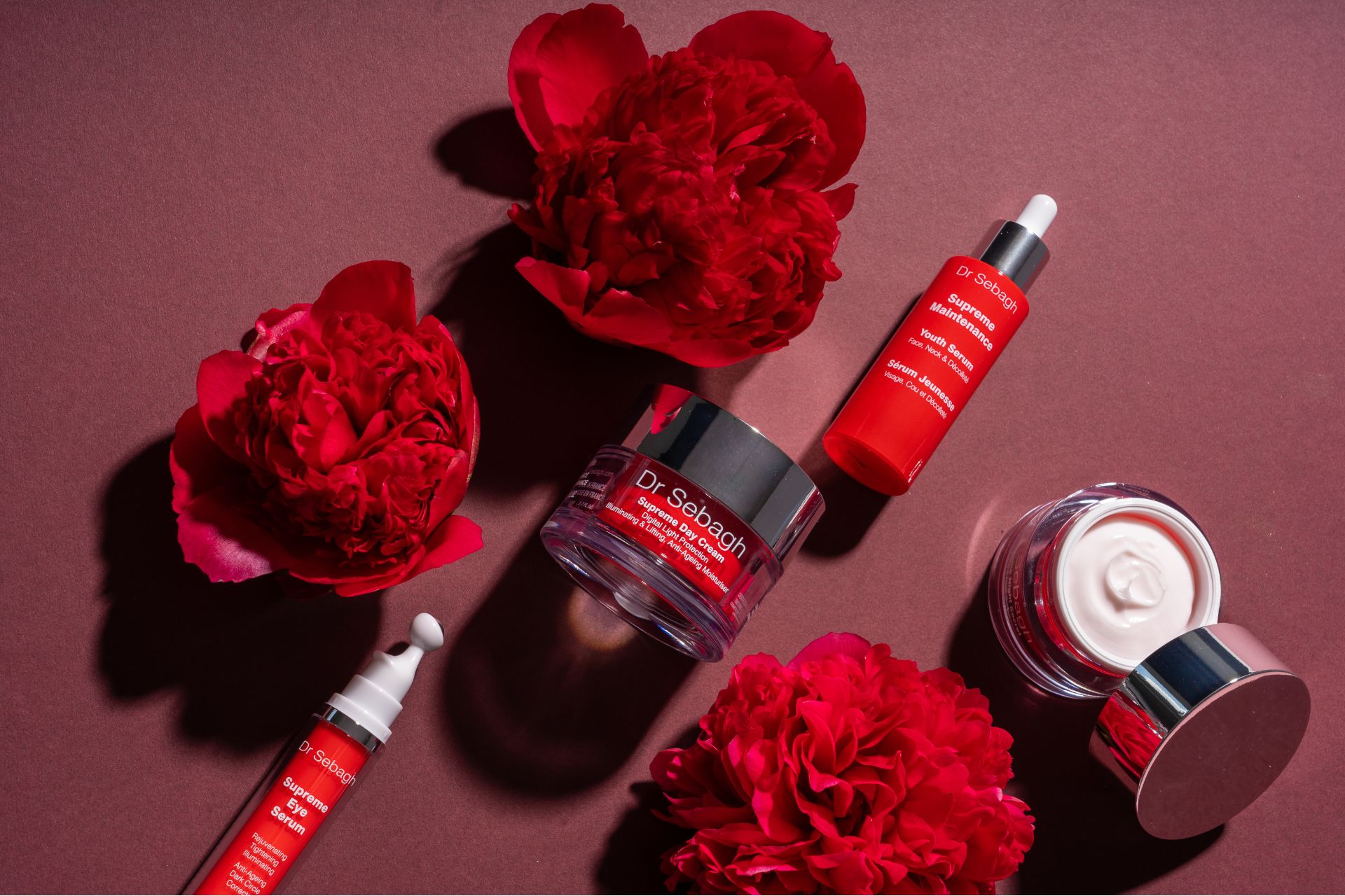 Dr Sebagh skincare with red peonies