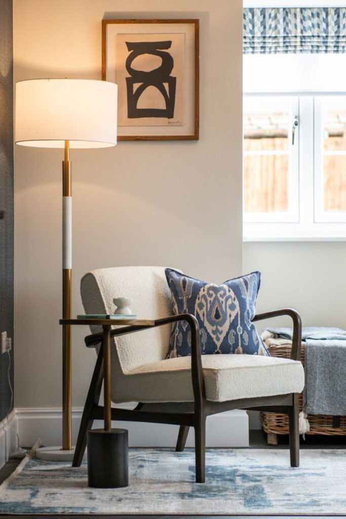 Study with cream chair, blue cushion and white floorlamp