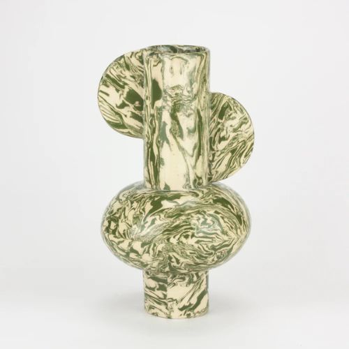 Green and white vase with cylindrical base and semicircular pieces on each side,