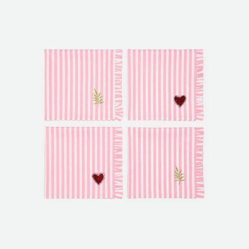 Pink and white striped napkins with red hearts and green foliage in the right hand corner
