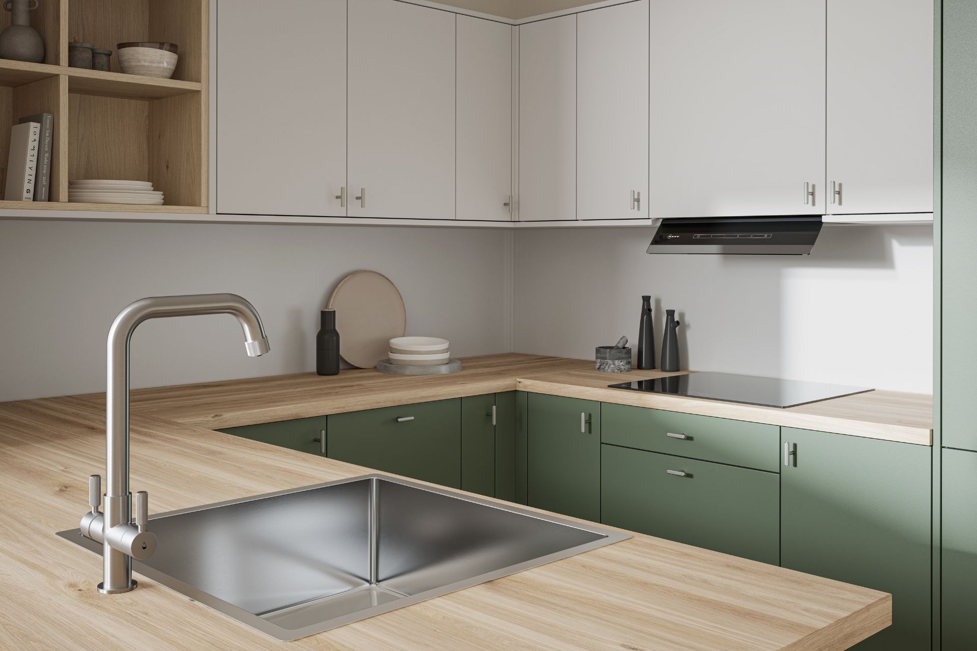 Sage green kitchen with pale wooden worktops and silver hardware