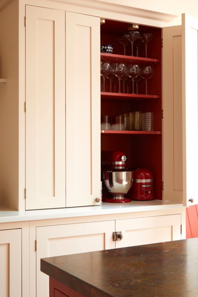 White Shaker cabinets with red shelves