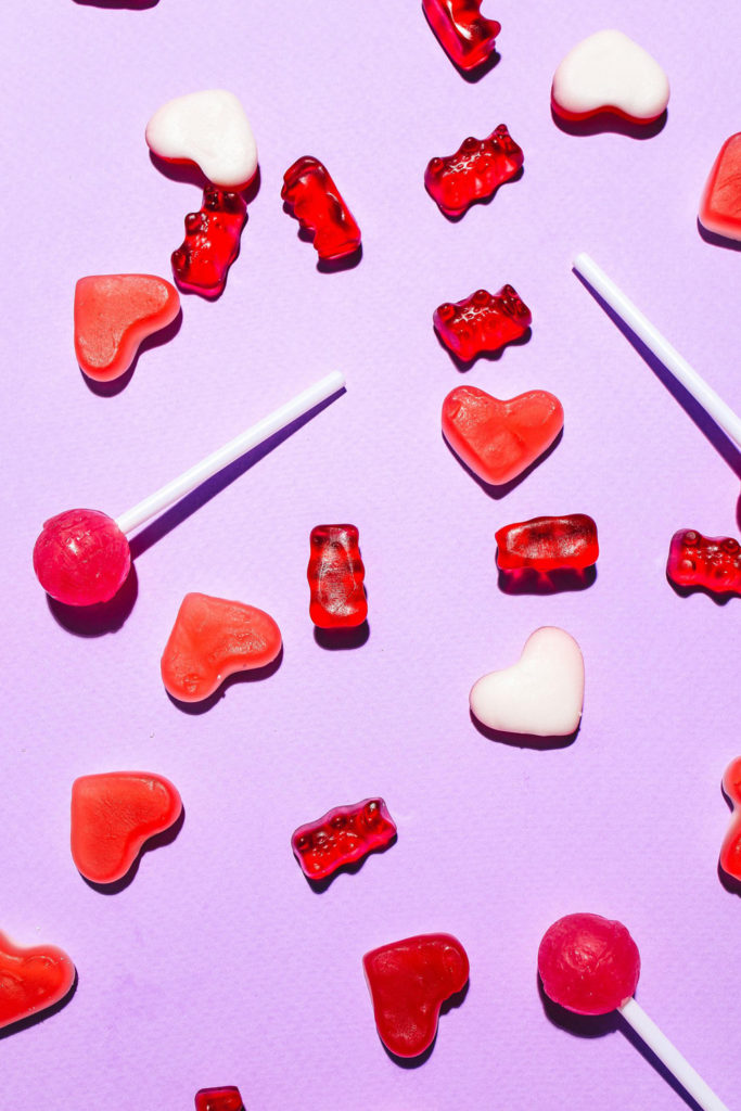 Red sweets on purple background