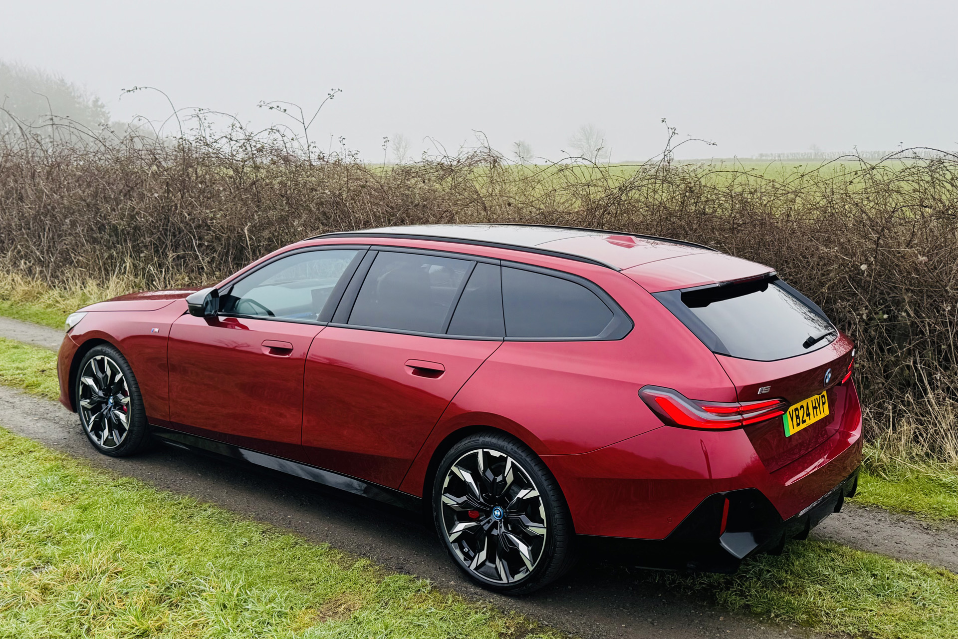 The BMW i5 in red