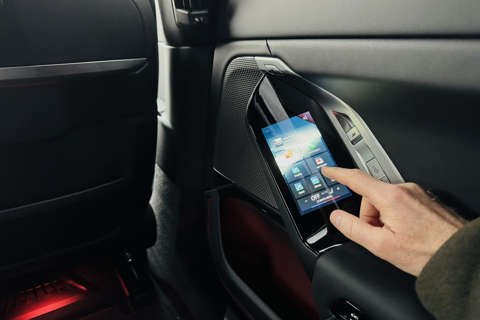 A touchscreen control in the back of the car