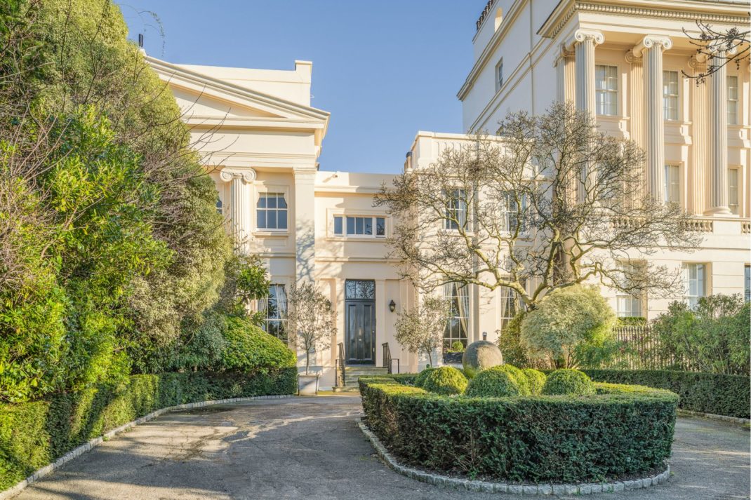 Exterior of John Nash-designed mansion with a circular driveway