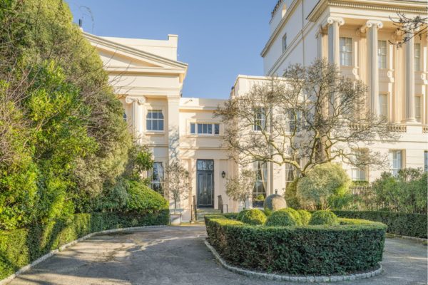 Exterior of John Nash-designed mansion with a circular driveway