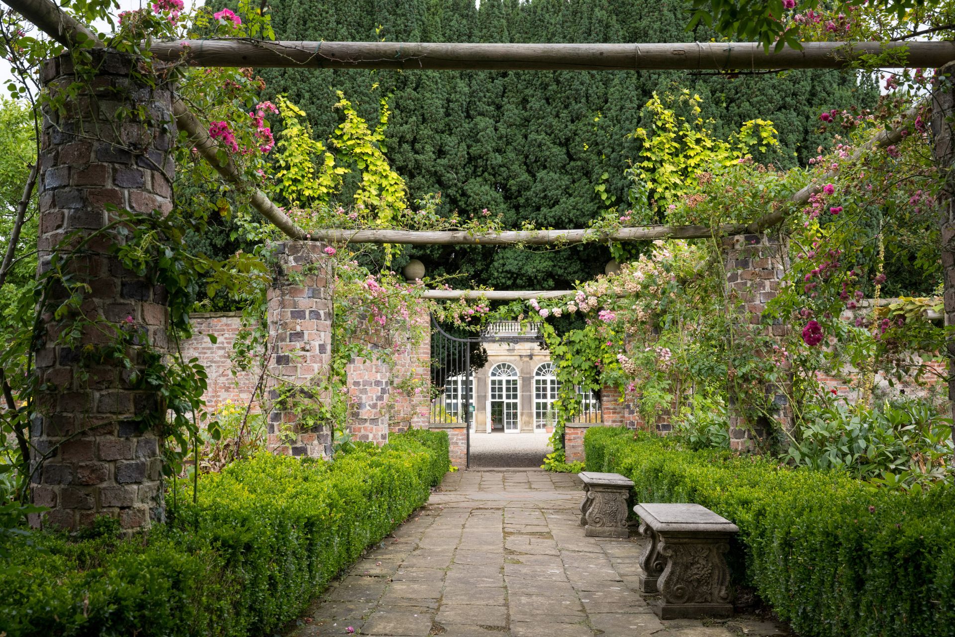 Walled rose garden with a stone path