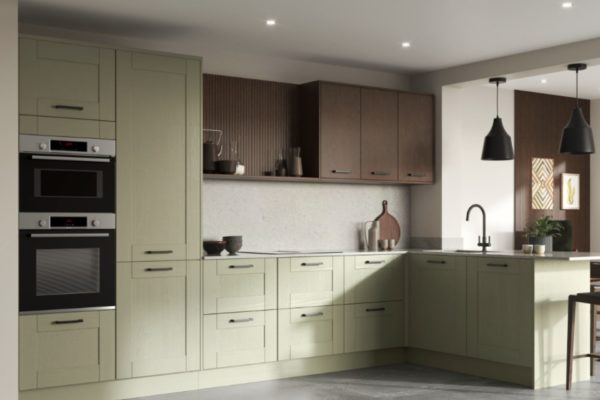 Sage green kitchen with gold fixtures