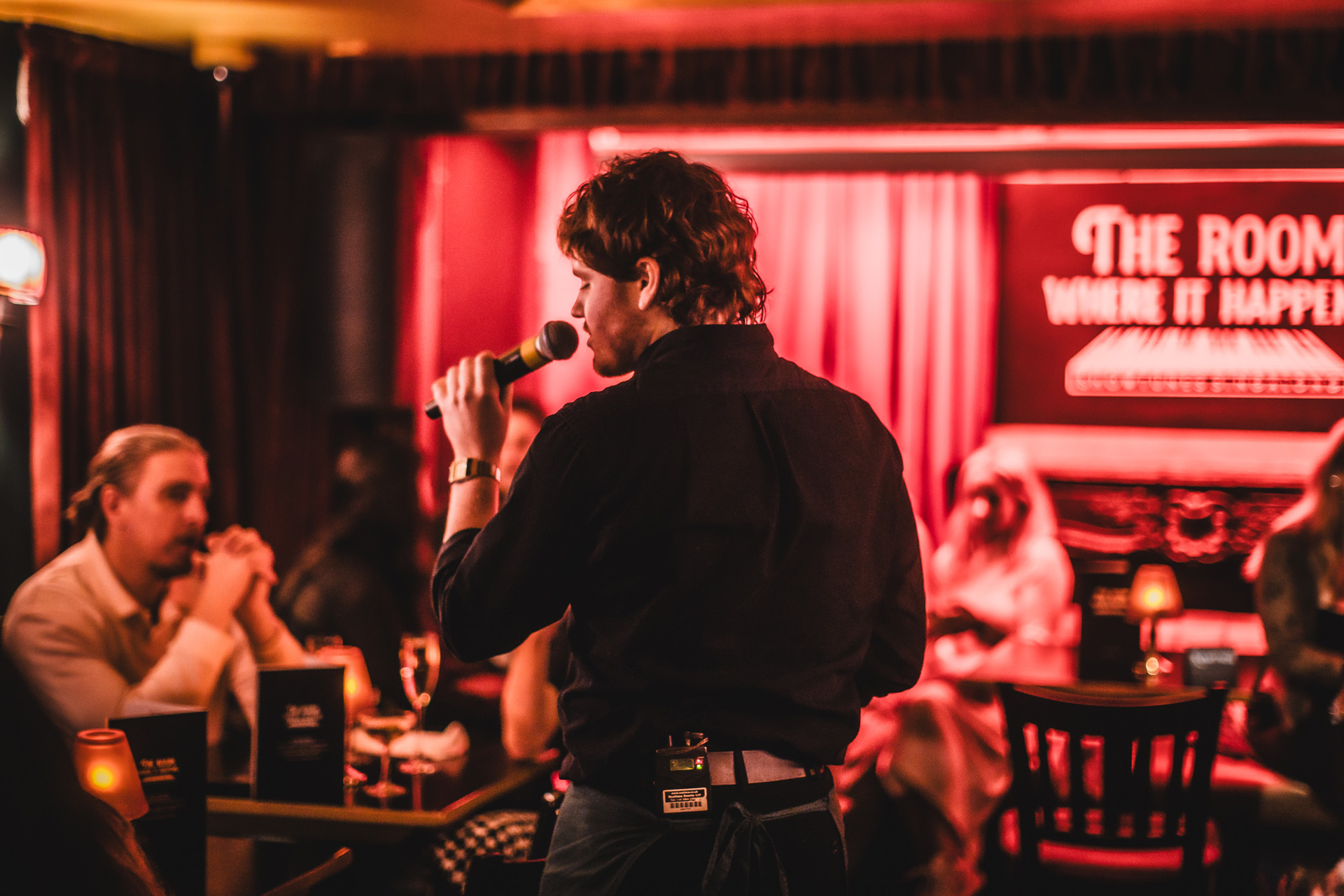 A man singing at The Room Where It Happens