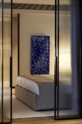 A mindfulness painting beside a bed